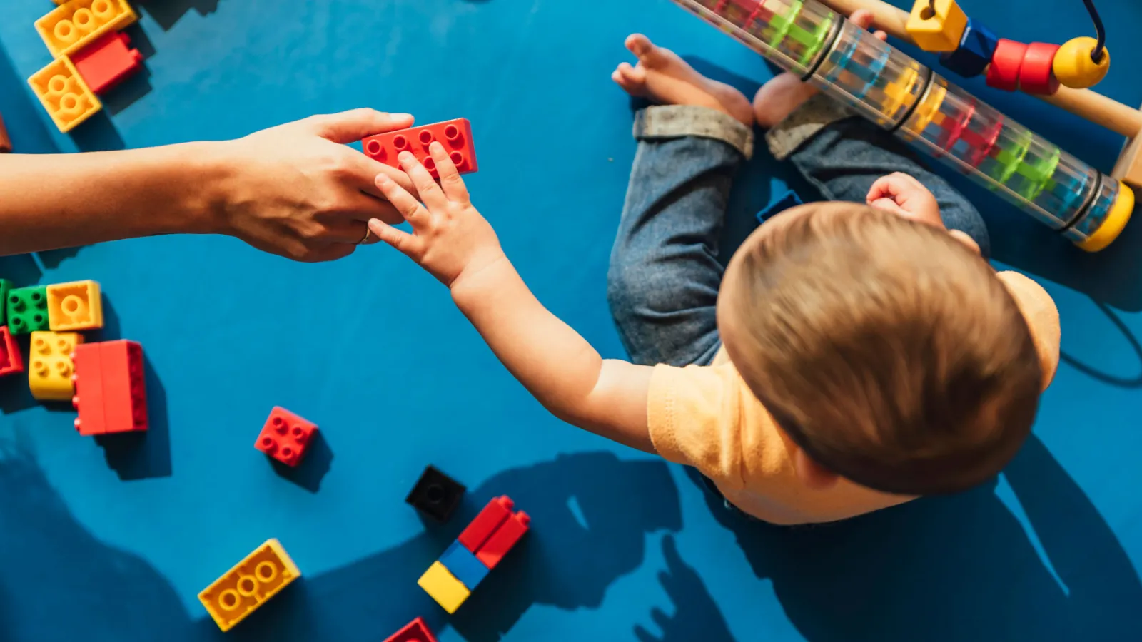 Happy baby with toy blocks