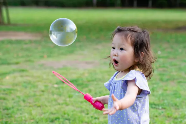 Small Hmong Girl with Bubbles